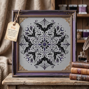 Könnte beinhalten: Ein gerahmtes Kreuzstichmuster mit einem symmetrischen Fledermaus-Mandala-Design in Schwarz und Lila auf einem weißen Gitter. Ein beiges Etikett am Rahmen zeigt: Etsy BAT MANDALA CROSS STITCH PATTERN 250x249 Stitches PDF Download By [Seller Name].