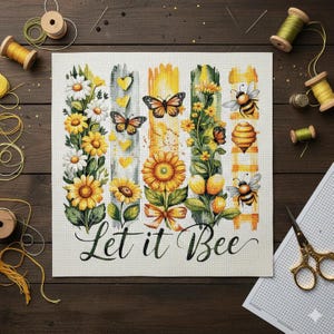 May include: A floral design featuring sunflowers, daisies, butterflies, and bees, with the phrase "Let it Bee". The colour scheme includes yellow, white, green, and orange tones, with a rustic aesthetic. The design is reminiscent of a cross-stitch.