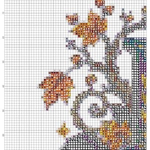 Pode incluir: Um padr&atilde;o de ponto cruz sobre um fundo de grade branca, rotulado 14 ct Aida Designed by AutumnAndrea. O design apresenta um galho de &aacute;rvore com folhas laranja e marrons, detalhes roxos e contornos pretos, com eixos numerados.