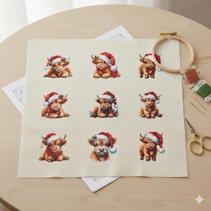 May include: A cross-stitch project featuring nine Highland cows wearing Santa hats. The cows are in various poses, stitched in shades of brown and tan. A wooden embroidery hoop, thread spools, and scissors are visible.