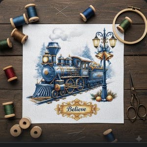Könnte beinhalten: Ein Kreuzstich-Design eines blauen Dampfzuges mit goldenen Akzenten vor einer verschneiten Kulisse. Das Wort "Believe" ist auf einem Banner zu sehen. Das Bild ist umgeben von Garnrollen, Nadeln, Scheren und einem Stickrahmen.