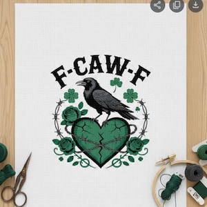 May include: Cross-stitch design featuring a black crow perched atop a cracked green heart, surrounded by green roses, barbed wire, and shamrocks. The text "F-CAW-F" arches above the crow. The design is on white fabric.
