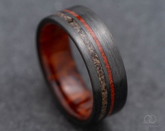 The Innovator | FREE ENGRAVING | Carbon Fiber Ring with Crushed T-Rex and Red Jasper Inlays and Thuya Wood Inner Sleeve | 7mm | Wedding Ring