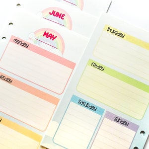 May include: Colorful planner pages with weekly layouts. Each day is labeled with a pastel-colored header, and the months of May, June are indicated with rainbow accents. The pages are lined for notes and have holes for binding.