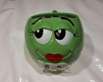 Vintage 1997 Round Green Mars M & M Girl With Eyelashes and Red Lips Ceramic Coffee Mug, 16 oz, Made in Thailand
