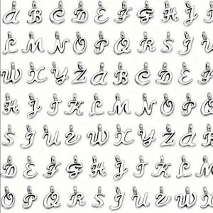 May include: A set of silver charm pendants featuring the alphabet in a cursive script. Each letter is individually crafted and ready to be added to a charm bracelet or necklace.