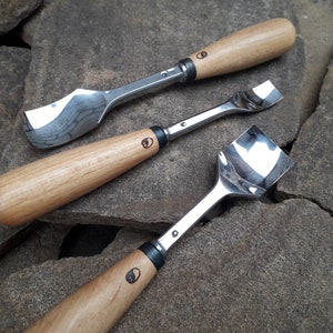 Forged curved gouge. Wood carving tools. Forged chisel.
