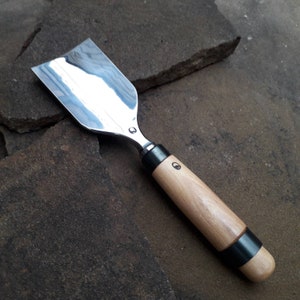 Forged chisel. Chisel for working with a mallet. Wood carving tool.