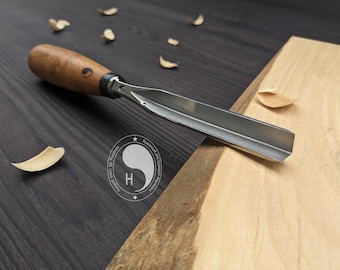 Forged V-chisel. Woodworking tool. woodcarving chisel