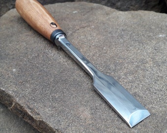 Forged flat chisel. Wood carving tool.