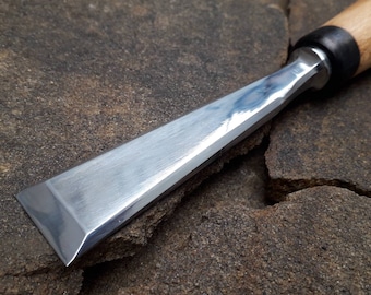 Forged carpentry chisel. Flat chisel Fishtail. Wood carving tool.