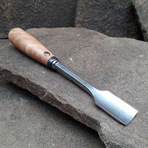 Forged gouge chisel. Wood carving tool.