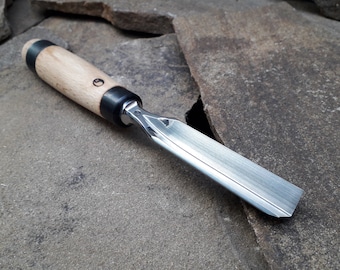 Forged V-chisel. Chisel for working with a mallet. Wood carving tool.