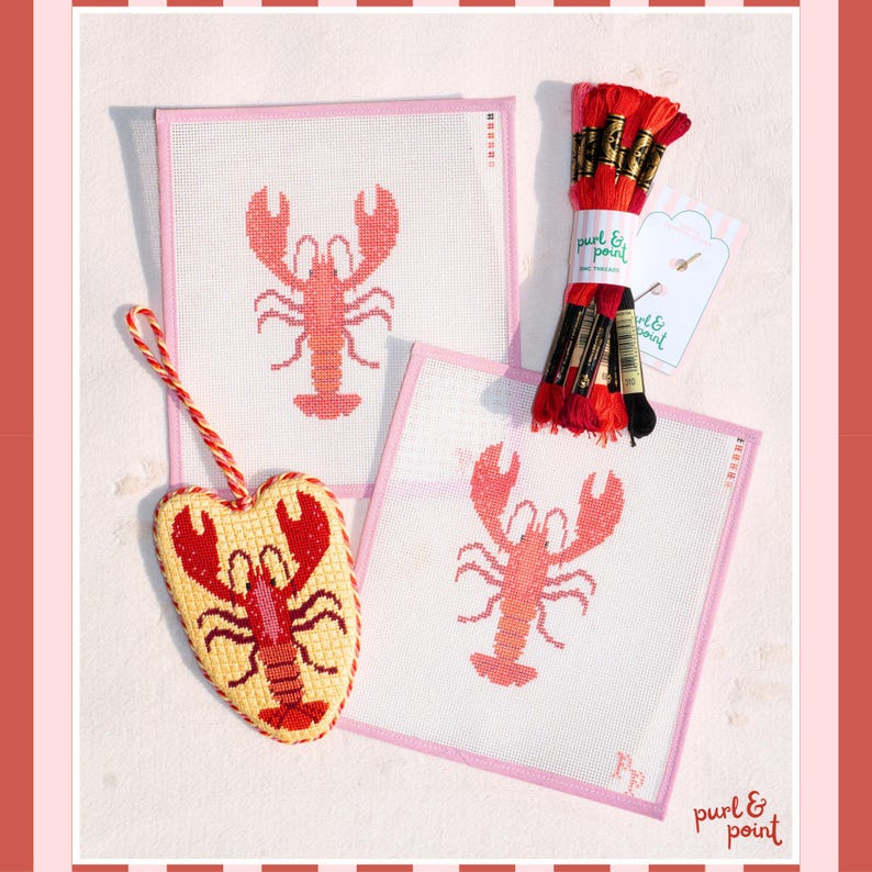 May include: Two square needlepoint canvases featuring a red lobster design, a heart-shaped finished needlepoint ornament with a red lobster, and a bundle of red and black embroidery floss with a Purl & Point label and two needles.