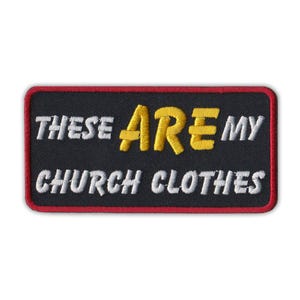 May include: Black embroidered patch with white and yellow stitching. The patch reads "These are my church clothes."