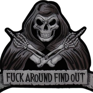May include: Embroidered patch featuring a grim reaper skull with crossed skeletal arms. The reaper is wearing a dark gray hooded cloak. The banner below reads "FUCK AROUND FIND OUT" in gray letters.