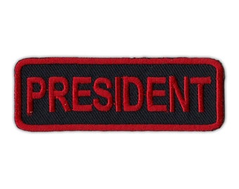 May include: Red embroidered patch with black background and the word "PRESIDENT" in red.