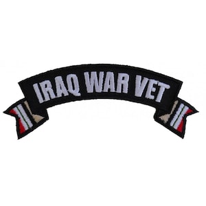 May include: Black and white embroidered patch with the text "IRAQ WAR VET" in a curved banner with a red, white, and green flag on each end.