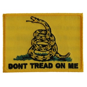 May include: A yellow embroidered patch with a coiled snake and the text "Don't Tread On Me".