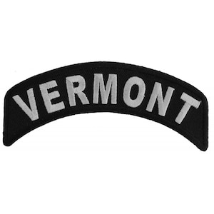 May include: Black and white embroidered patch with the word "VERMONT" in white lettering.