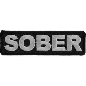 May include: Black embroidered patch with the word "SOBER" in white lettering.