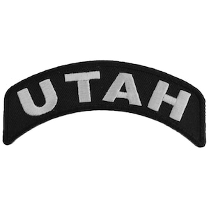 May include: Black and white embroidered patch with the word "UTAH" in white lettering.