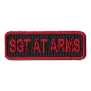 May include: Red embroidered patch with black background and the text "Sgt At Arms" in red.