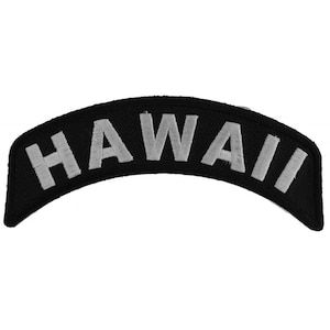 May include: Black and silver embroidered patch with the word "HAWAII" in a curved shape.