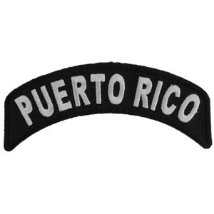May include: Black and white embroidered patch with the text "PUERTO RICO" in a curved shape.