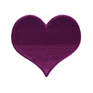 May include: A purple heart-shaped patch with a textured surface.