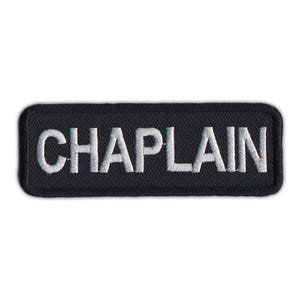 May include: Black embroidered patch with white lettering that reads "CHAPLAIN".
