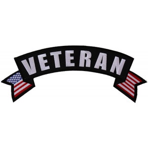 May include: Black and white embroidered patch with the word "Veteran" in a white banner with American flag details on each end.