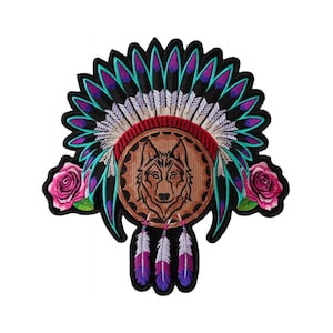 May include: Embroidered patch featuring a wolf's head inside a dreamcatcher with feathers and roses. The dreamcatcher is decorated with turquoise, purple, and white feathers.