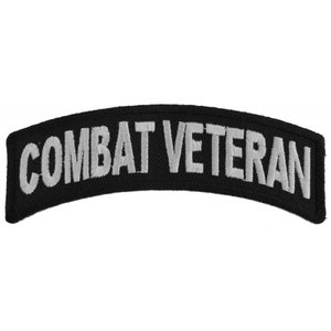 May include: Black and silver embroidered patch with the text "COMBAT VETERAN".