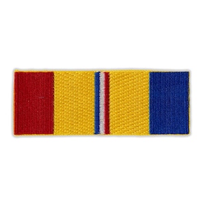 May include: A red, white, and blue ribbon with a yellow background. The ribbon is a military decoration.