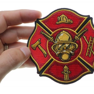 May include: A red and gold firefighter patch with a crossed axe, hose, and ladder. The patch also features a firefighter helmet, a gas mask, and a fire hydrant.