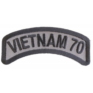 May include: Gray embroidered patch with the text "VIETNAM 70" in black.