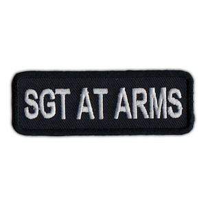 May include: Black embroidered patch with white text that reads "Sgt At Arms".