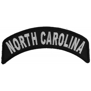 May include: Black and white embroidered patch with the text "NORTH CAROLINA" in a curved shape.