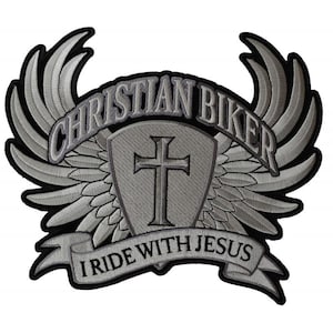 May include: A silver embroidered patch with a cross inside a shield, surrounded by wings and a banner that reads "Christian Biker I Ride With Jesus".