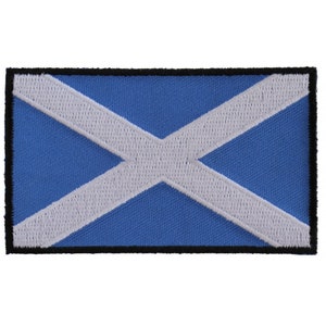 May include: A blue and white embroidered patch featuring the Scottish flag. The flag is a white saltire, or X, on a blue background.