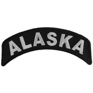 May include: Black and white embroidered patch with the word "ALASKA" in white lettering.
