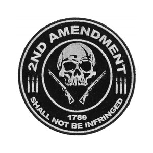 May include: Black and white embroidered patch with a skull and crossbones, two rifles, and the text "2nd Amendment Shall Not Be Infringed 1789".