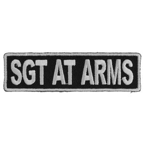 May include: Black and white embroidered patch with the text "Sgt At Arms" in white lettering.