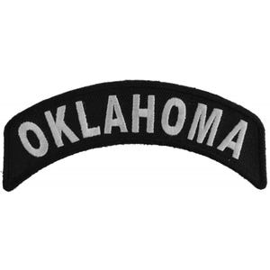May include: Black embroidered patch with white lettering that reads "OKLAHOMA".