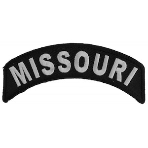 May include: Black and white embroidered patch with the word "MISSOURI" in white lettering.