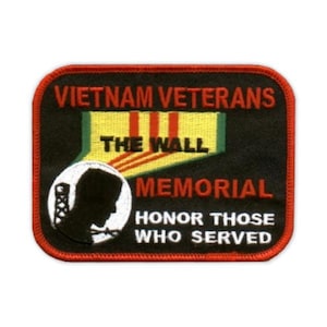 May include: Rectangular patch with a red border and black background. The patch features the text "VIETNAM VETERANS THE WALL MEMORIAL HONOR THOSE WHO SERVED" in white and red. A circular emblem shows a soldier's silhouette.