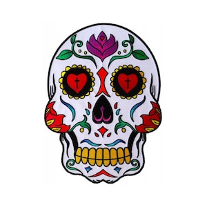 May include: A white sugar skull with colorful floral designs, red hearts with crosses, and yellow teeth. The skull is a traditional Mexican Day of the Dead symbol.