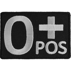 May include: Black embroidered patch with white lettering that reads "O+ POS".