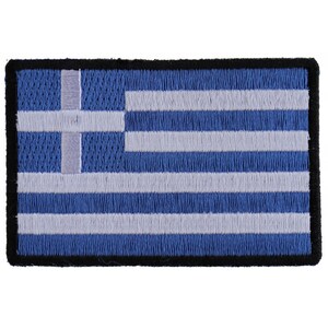 May include: An embroidered patch of the Greek flag. The flag is blue with nine white horizontal stripes and a white cross in the upper left corner. The patch has a black border.